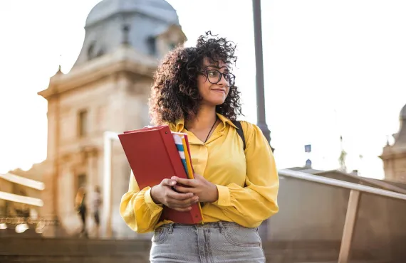 Student holding Books