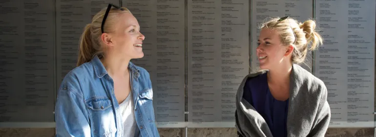 Students relax and chat on campus